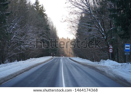 Nature photography of the winter fairy forest and the road.