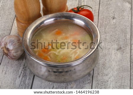 Chicken soup with noodles, carrot and celery