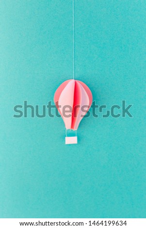 blue background with one balloon of paper, handmade