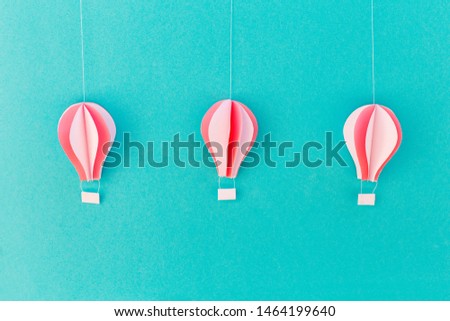 blue background with three balloon of paper, handmade