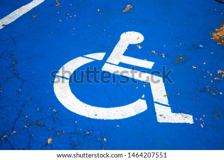 A sign on the parking space - parking for people with disabilities.