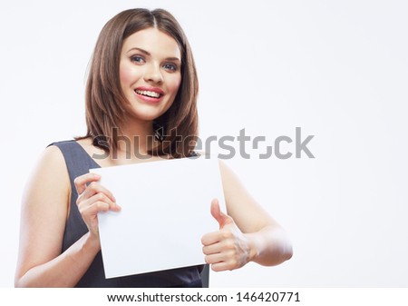 Business woman hold white blank paper. Thumb up. Young smiling girl show blank board. Female model portrait isolated on white background.