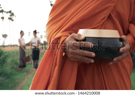 The monk walked to get alms in the morning.