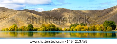 Panoramic Reflections of Yellow Autumn Trees Royalty-Free Stock Photo #1464213758