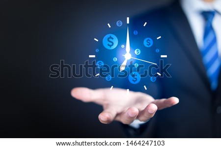 Businessman hand holding clock and money icon, Business time management and business time is money concepts Royalty-Free Stock Photo #1464247103