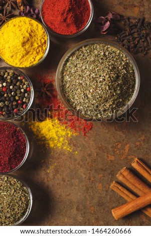 Dried Marjoram . Place for text. Different types of Spices in a bowl on a stone background. The view from the top.