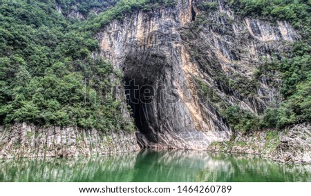 a cave opening on shennong stream off the yangtse river china Royalty-Free Stock Photo #1464260789