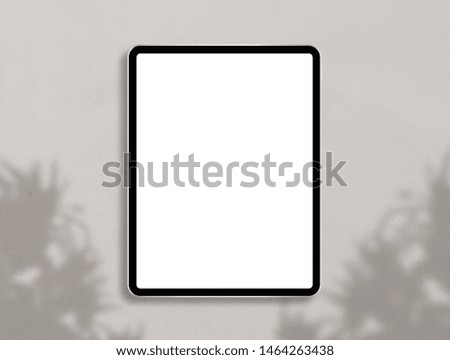Digital tablet computer with blank screen. Modern tablet mockup photo. Top view mockup scene. Template for branding identity. Photo mockup with clipping path.