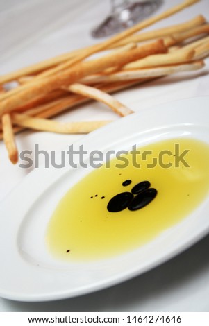 Restaurant picture, organic olive oil with balsamic vinegar, pasta with tomato sauce, bread sticks and glass of wine. 