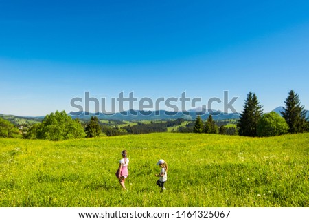 Blooming valley. View of the village Yablunitsa and the Carpathian Mountains and hills. Royalty-Free Stock Photo #1464325067