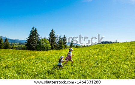 Blooming valley. View of the village Yablunitsa and the Carpathian Mountains and hills. Royalty-Free Stock Photo #1464331280