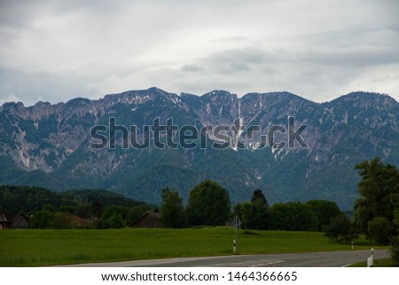 Alps, Austria Beautiful landscape with Alp. Mountains peaks covered with snow in a cloudy day