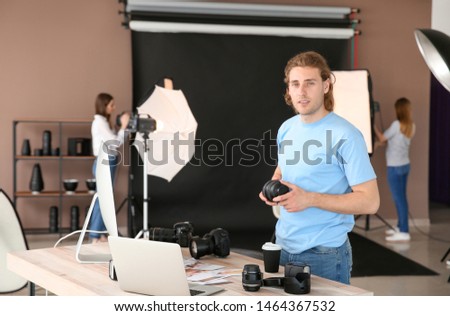 Professional photographer working in modern studio
