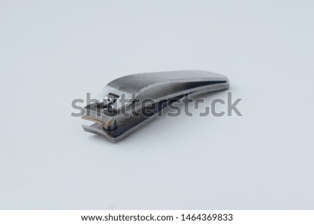 Close-up photos of metal nail clippers on a white background