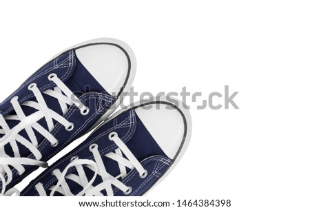 Clothes, shoes and accessories - top view fragment closeup pair blue gumshoes isolated white background