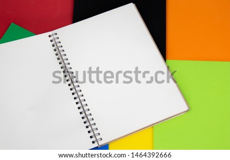 Mockup of textured paper on abstract color background.