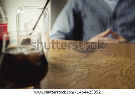 successful businessman drinks whiskey with ice