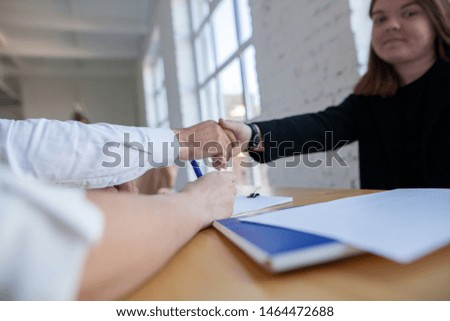 Businessman handshake at business meeting after negotiations with business partners.
