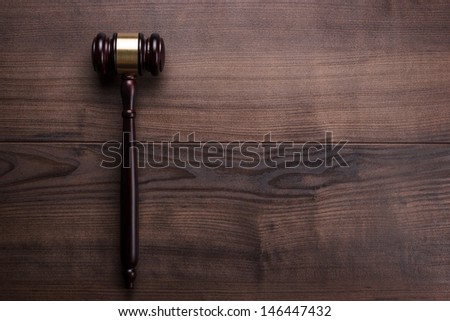 judge gavel on the brown wooden table with space for text Royalty-Free Stock Photo #146447432