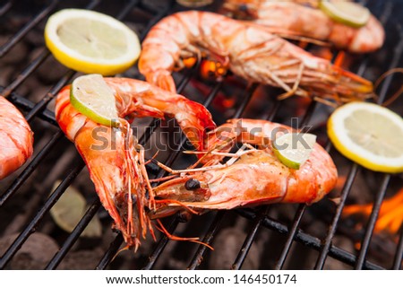 Grilled king size prawns on fire
