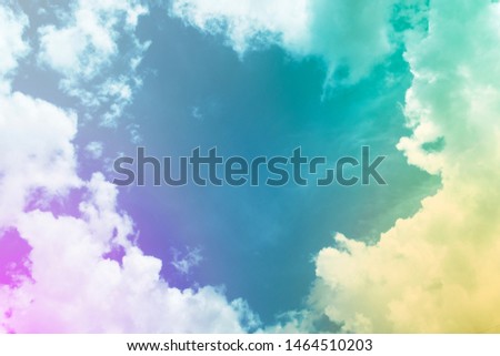 Abstract nature background of Colorful sky. Romantic pastel sunset dawn with clouds of white-blue-green-pink-violet-yellow color in summer sunshine day, amazing landscape, copy space in heart shape 