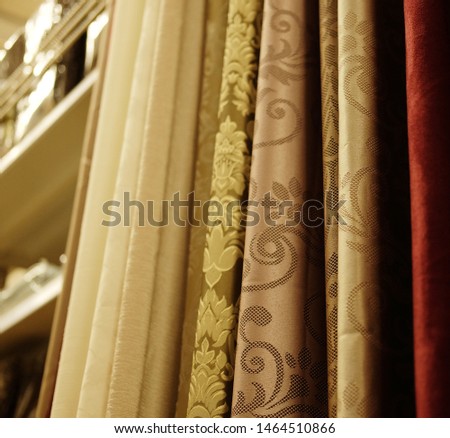Sale- colorful fabrics in the store. shopping concept