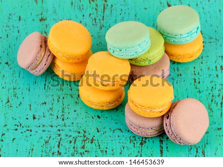 Macaroons on wooden table close-up