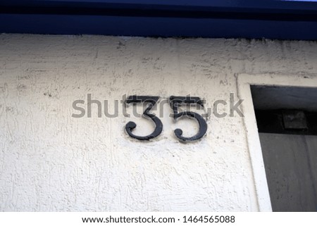 
Number 35, street number  on a facade.
