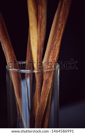 Long bread sticks decorated in glass