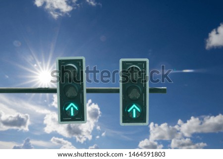 Traffic light against blue sky background