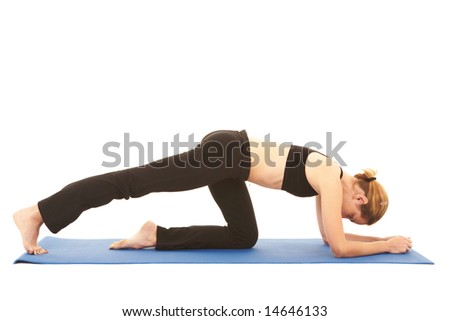 Fit young brunette pilates instructor showing different exercises on a white background with basic pilates equipment ion a yoga mat. White background, NOT ISOLATED