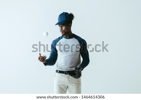 handsome african american sportsman with baseball glove and ball isolated on grey