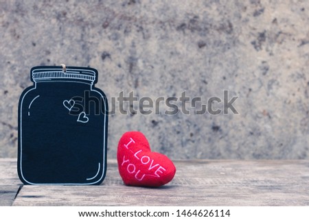 Retro style black wooden tag with hearts on wall. Simple and minimal frame and wallpaper. Copy space for text. Love photo concept of friend, family, couple, lover and background.