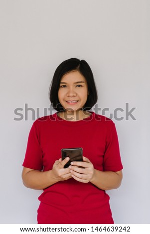 Happy smiling woman with smartphone on white background
