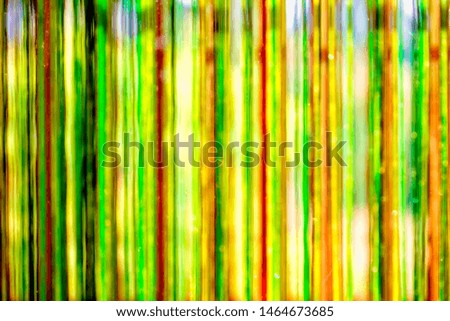 Abstract background - greenish strings behind the glass - water colors in the area of intentional defocus macro