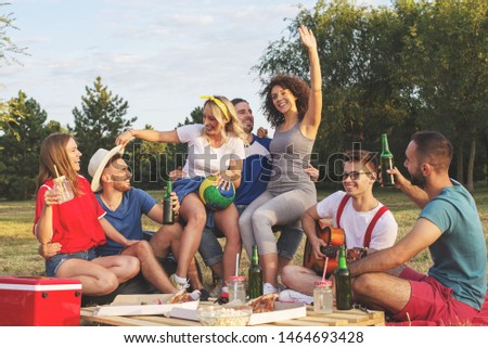 Young friends enjoy in party at the park