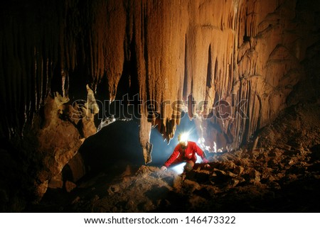 Beautiful stalactites in a cave  Royalty-Free Stock Photo #146473322