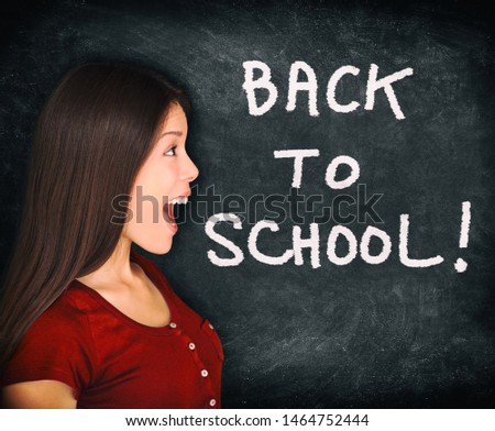 Back to school happy Asian woman screaming of fun next to text writing in chalk on black board blackboard texture background.