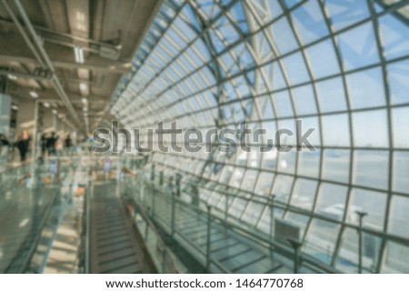 Blur background of large building interior at the hallway.
