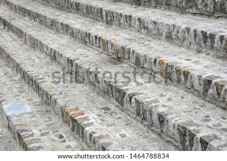 Cobblestone granite steps close-up abstract background