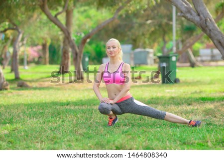 
pretty young girl engaged in fitness in the park