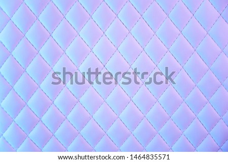 wrinkled abstract 80s texture with multiple colorsGeometric diamond pattern quilted PU leather in neon light. gradient mosaic textured multi-colored background.