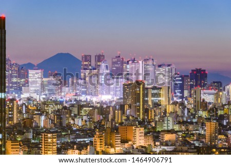 Skyline of Shinjuku, Tokyo, Japan with Mt. Fuji visible.