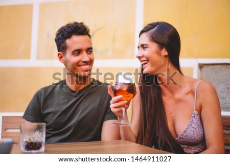 Couple man and woman drink a refreshing and cold beer.