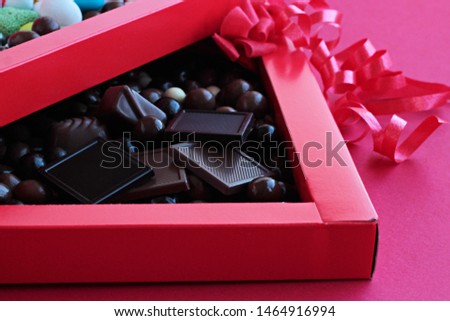 Luxury,Madlen and Dark Ball Chocolate in red color carton box with red  ribbon.