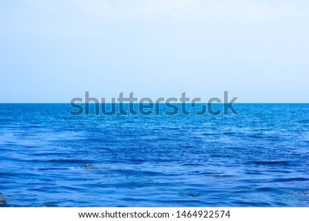 the sea joins the sky on the horizon