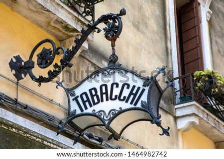 An old-fashioned Tabacchi, or Tobacco, sign above a shop in Venice, Italy.