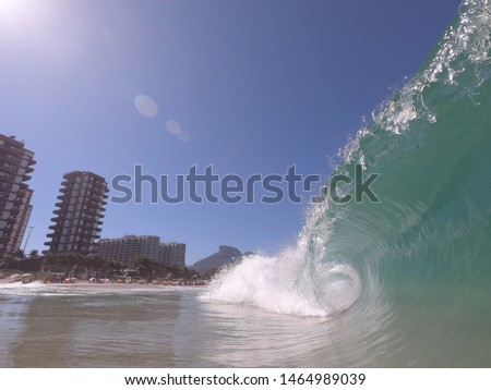 Perfect wave tube on a sunny day in Barra da Tijuca's beach,  Rio de Janeiro  - Brazil 