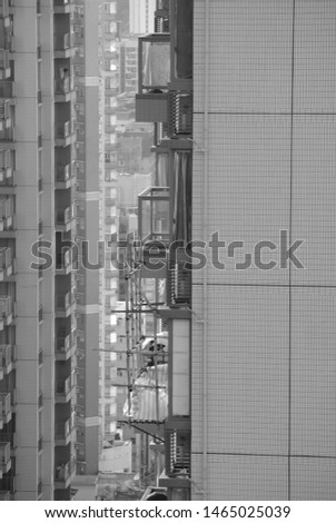 Bamboo scaffolding on hong kong buildings , black and white photo