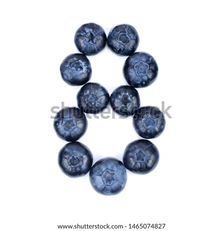 Blueberry on white background. A bit smaller digit 8 from blueberry. Food digits.